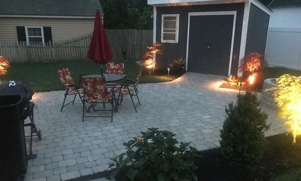 Outdoor landscape lighting installation by P.J. Pappas