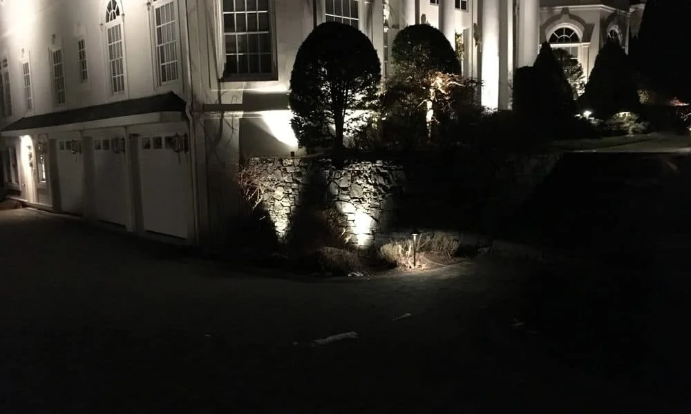 Outdoor landscape lighting installation by P.J. Pappas